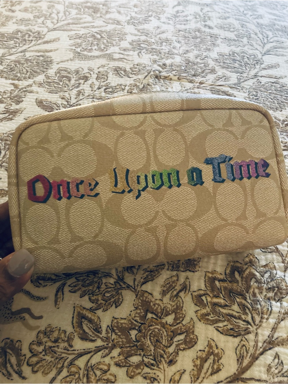 Coach Beige Canvas 'Once Upon a Time' Zip Pouch with Multicolor letters.